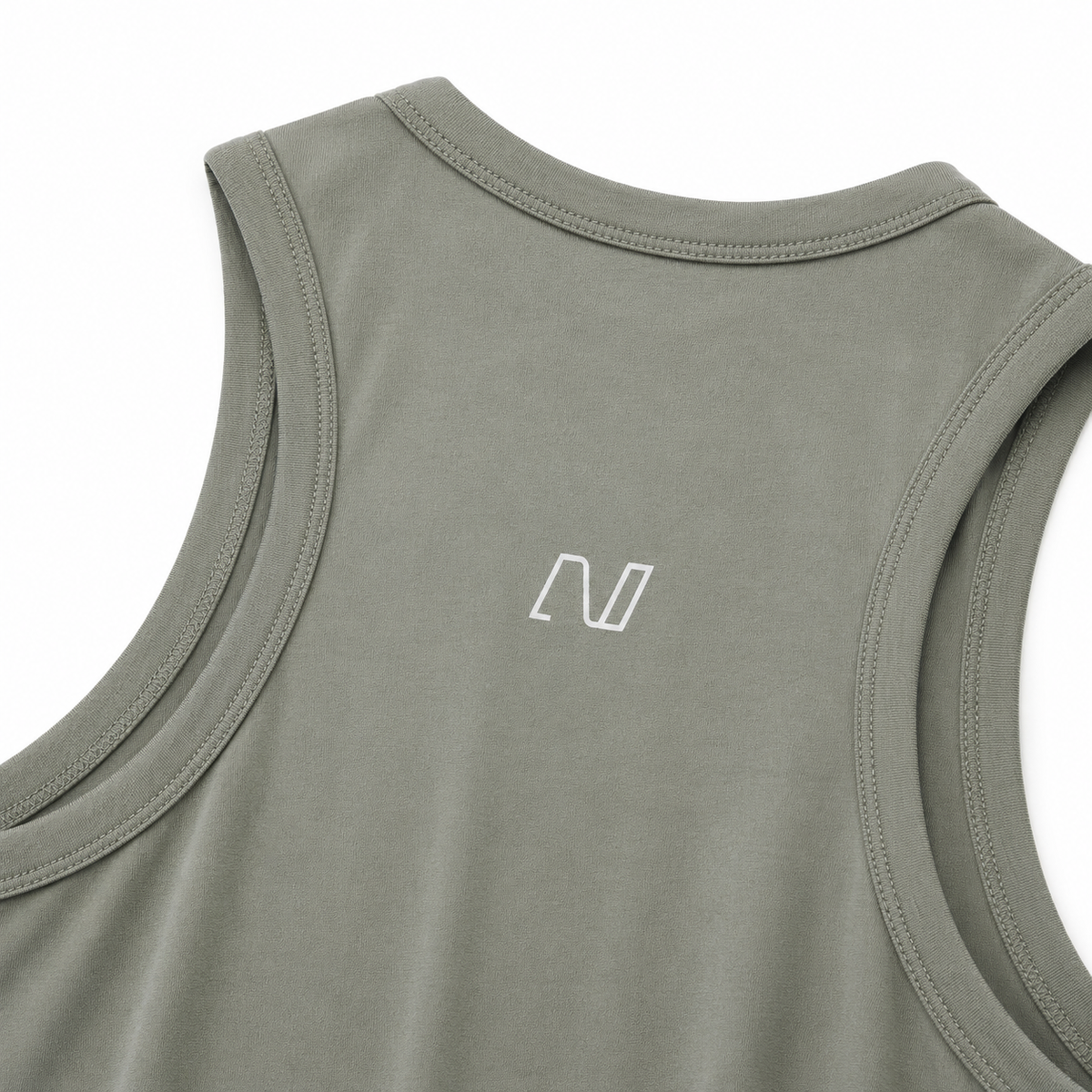 NONVØLI logo detail on olive women's pickleball tank top